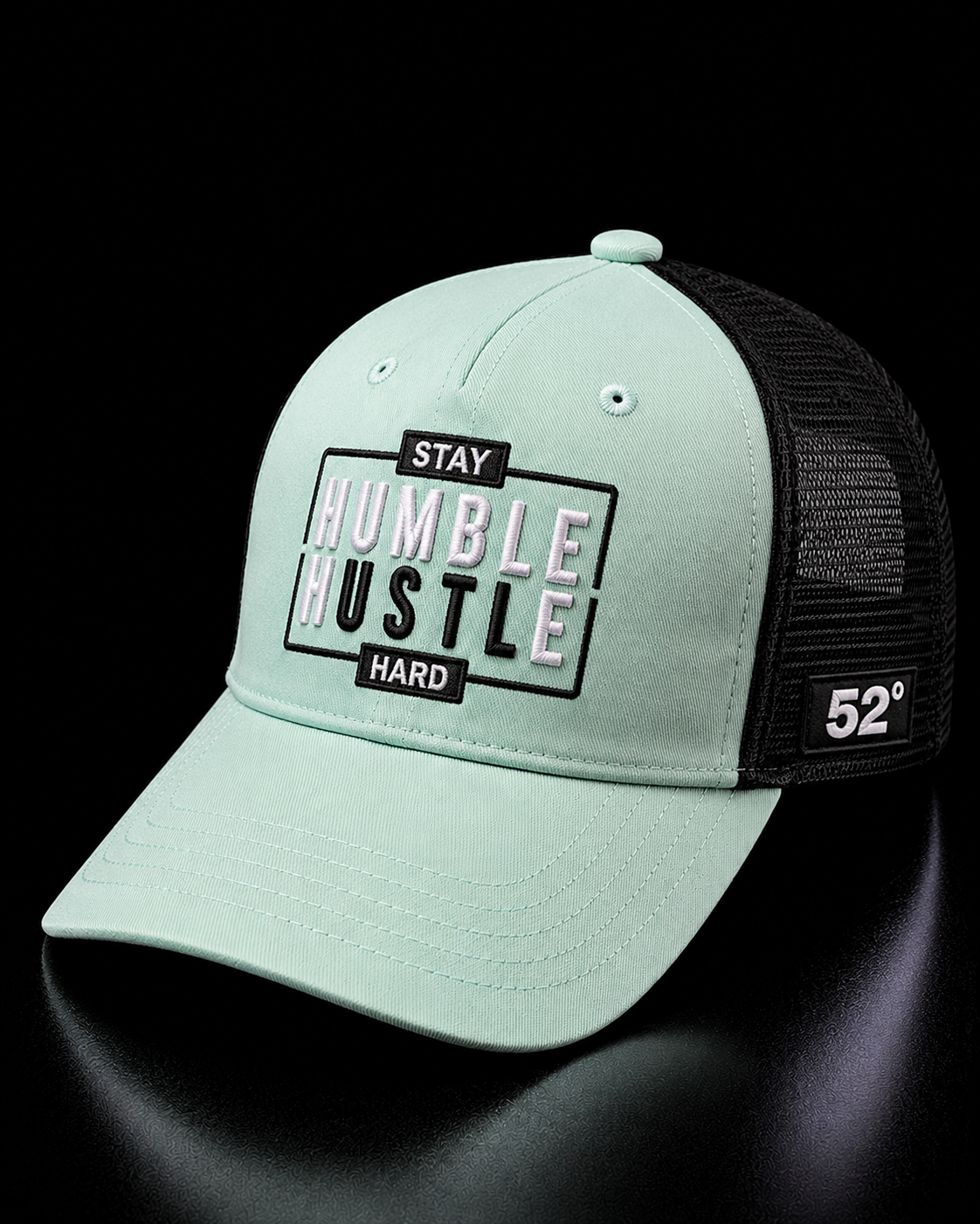 Mint green cap with text on a black background