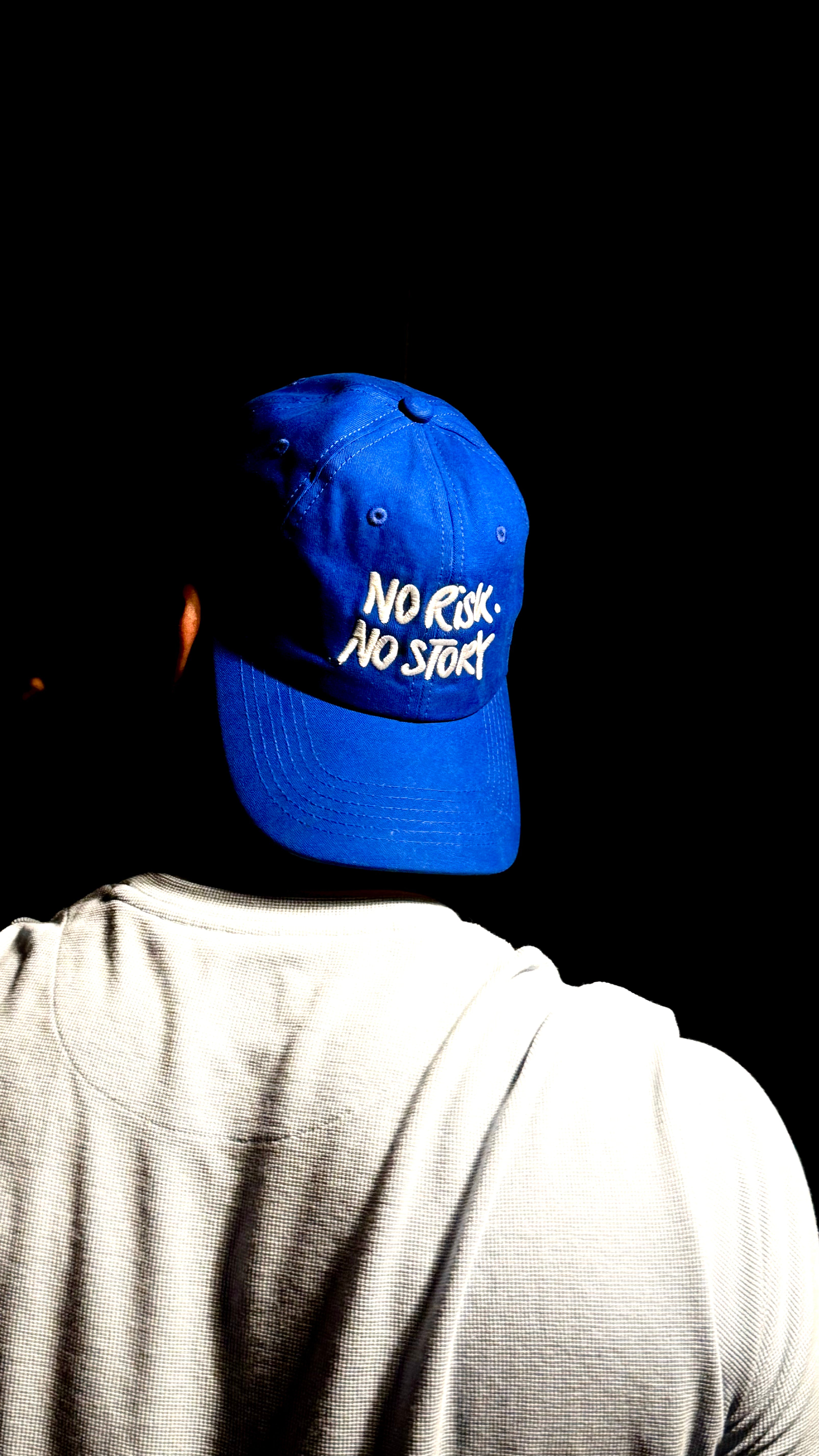 Person wearing a blue cap text on a black background