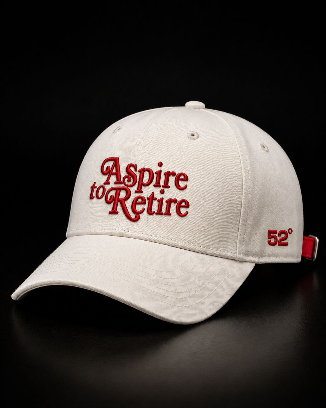 White cap with 'Aspire to Retire' in red text on a black background