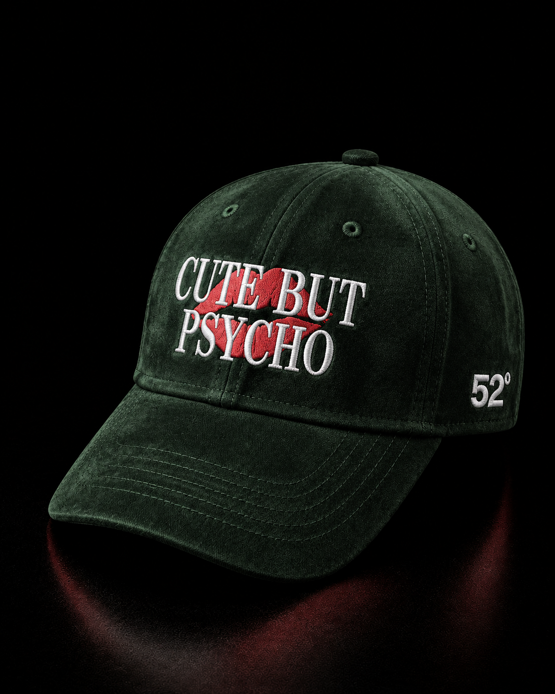 Green suede cap with 'Cute But Psycho' text on a dark background