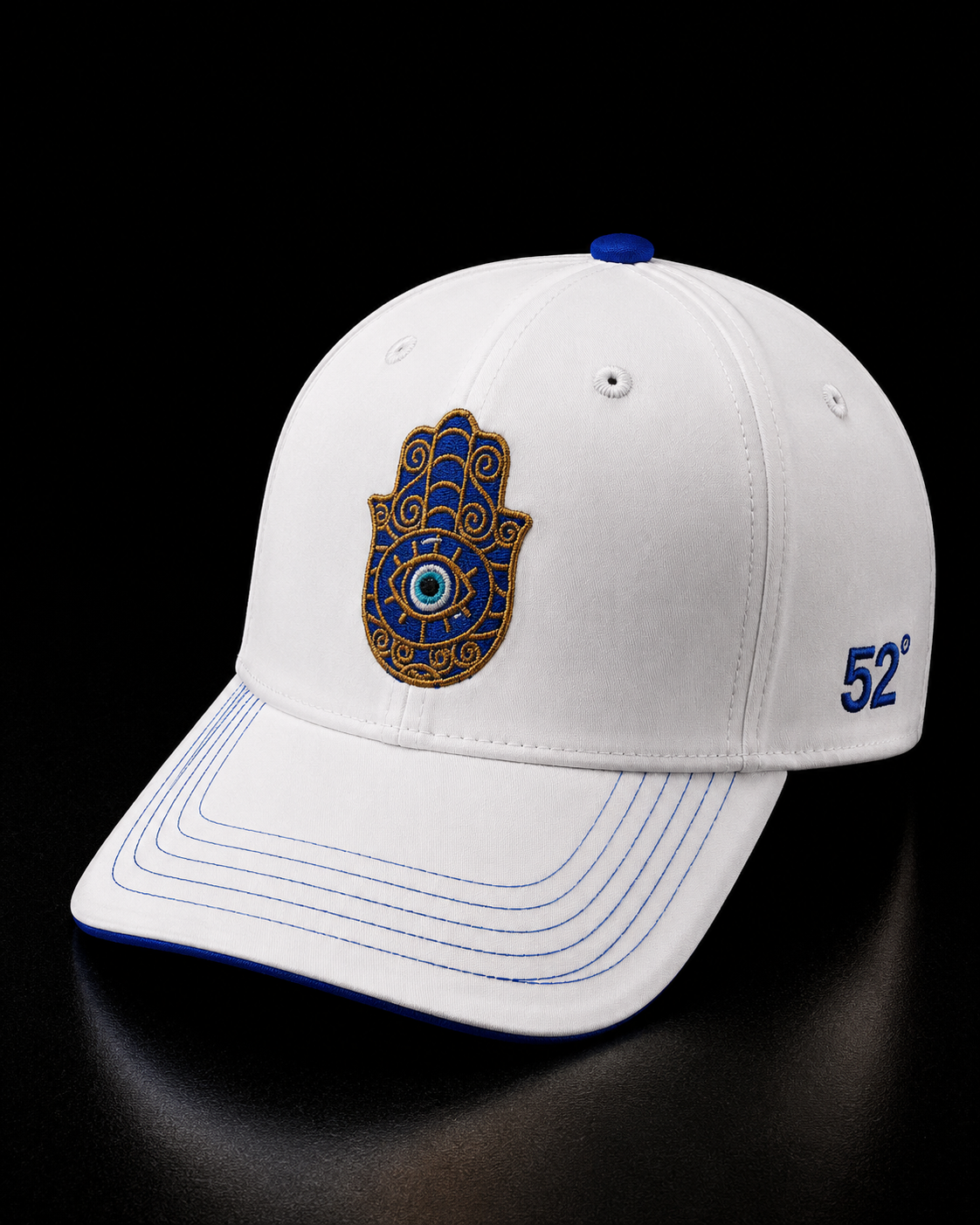White cap with Hamsa hand design and '52' logo on a black background