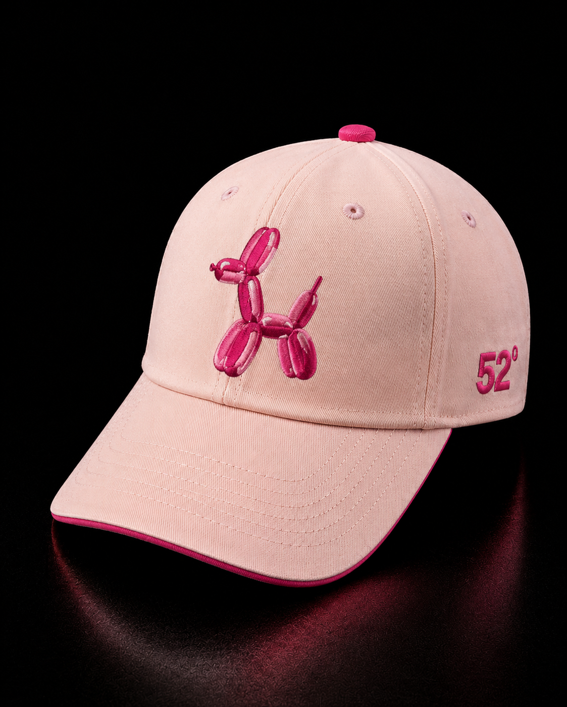 Pink cap with balloon dog design and '52' logo on a black background