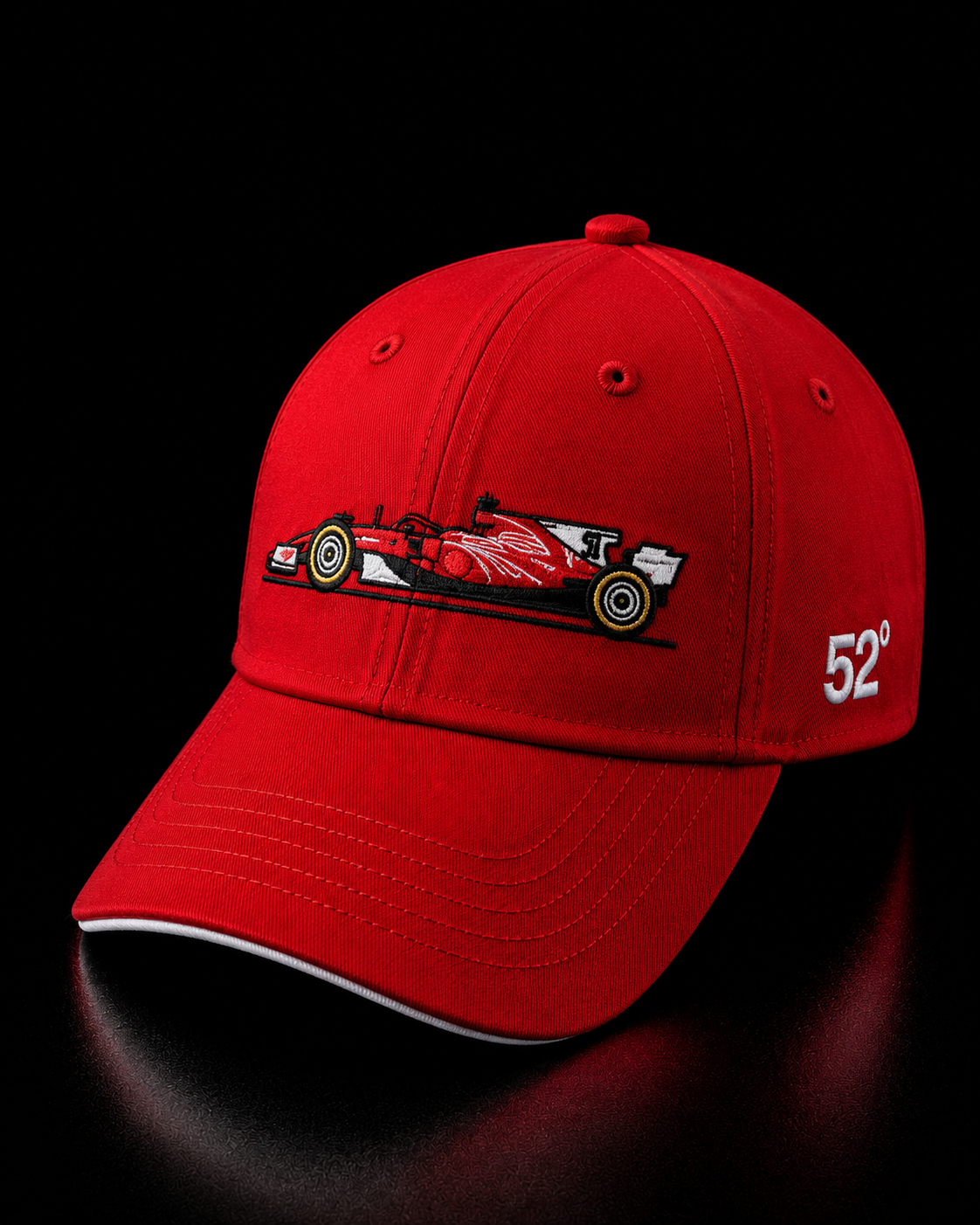 Red cap with a Formula 1 car design and number 52 on a black background